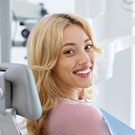 Closeup of smiling patient sitting in treatment chair