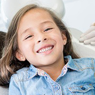 Smiling little girl in dental chair