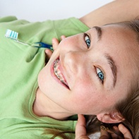 Young girl with traditional braces