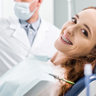 Patient with braces visiting her orthodontist