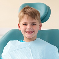 Smiling young boy in dental chair