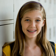 Young girl with traditional braces