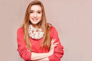 girl with braces wearing a scarf