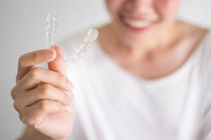 Woman smiling with Invisalign 